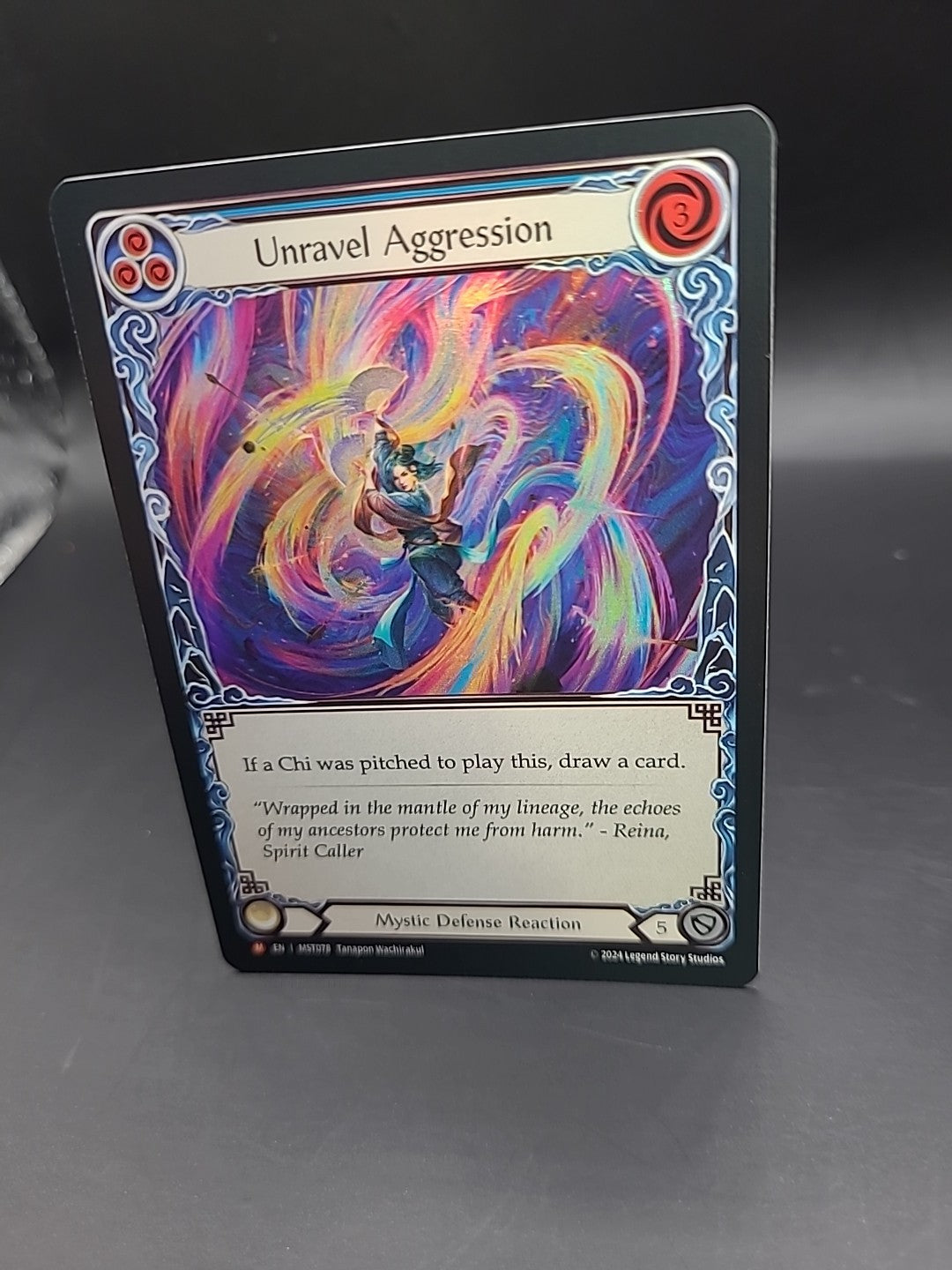 Unravel Aggression Foil - MST078 NM - FaB Flesh and Blood