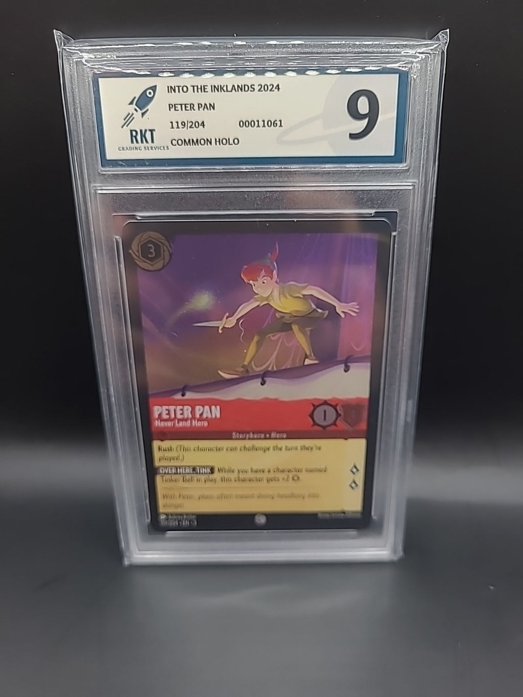 Lorcana PETER PAN 119/204 COMMON HOLO RKT Grading 9