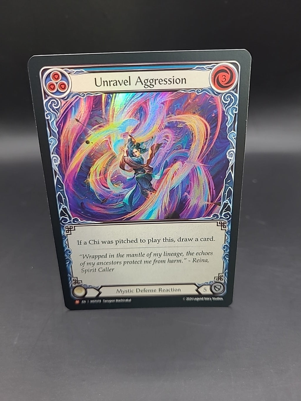 Unravel Aggression Foil - MST078 NM - FaB Flesh and Blood
