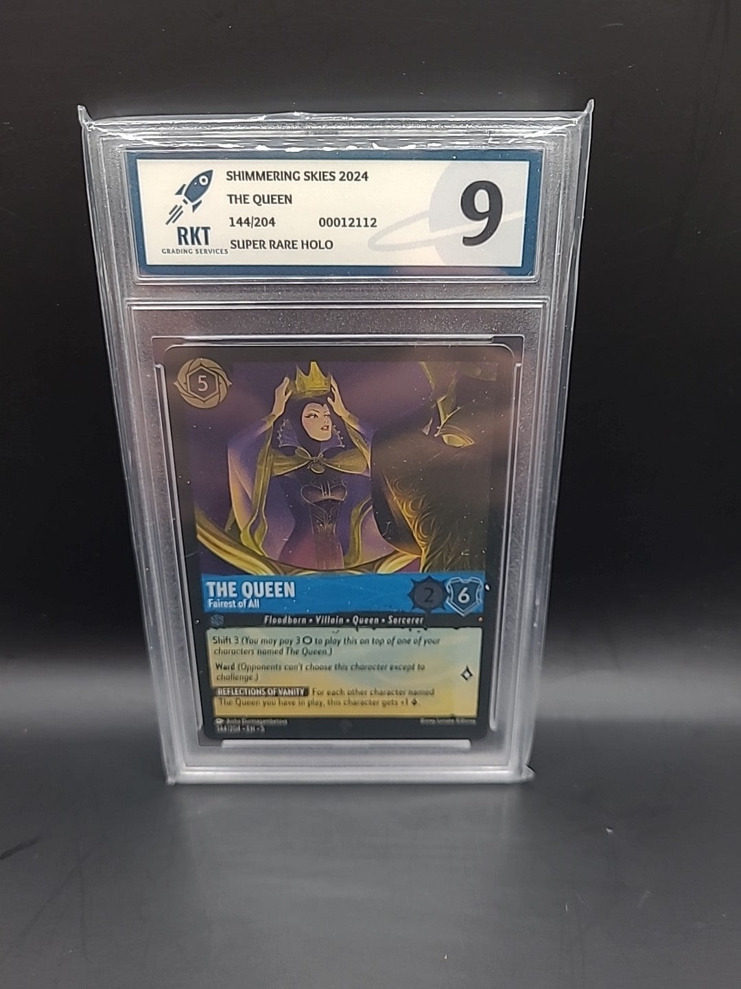 144/204 THE QUEEN FAIREST RKT GRADED 9 SUPER RARE DISNEY LORCANA CARD